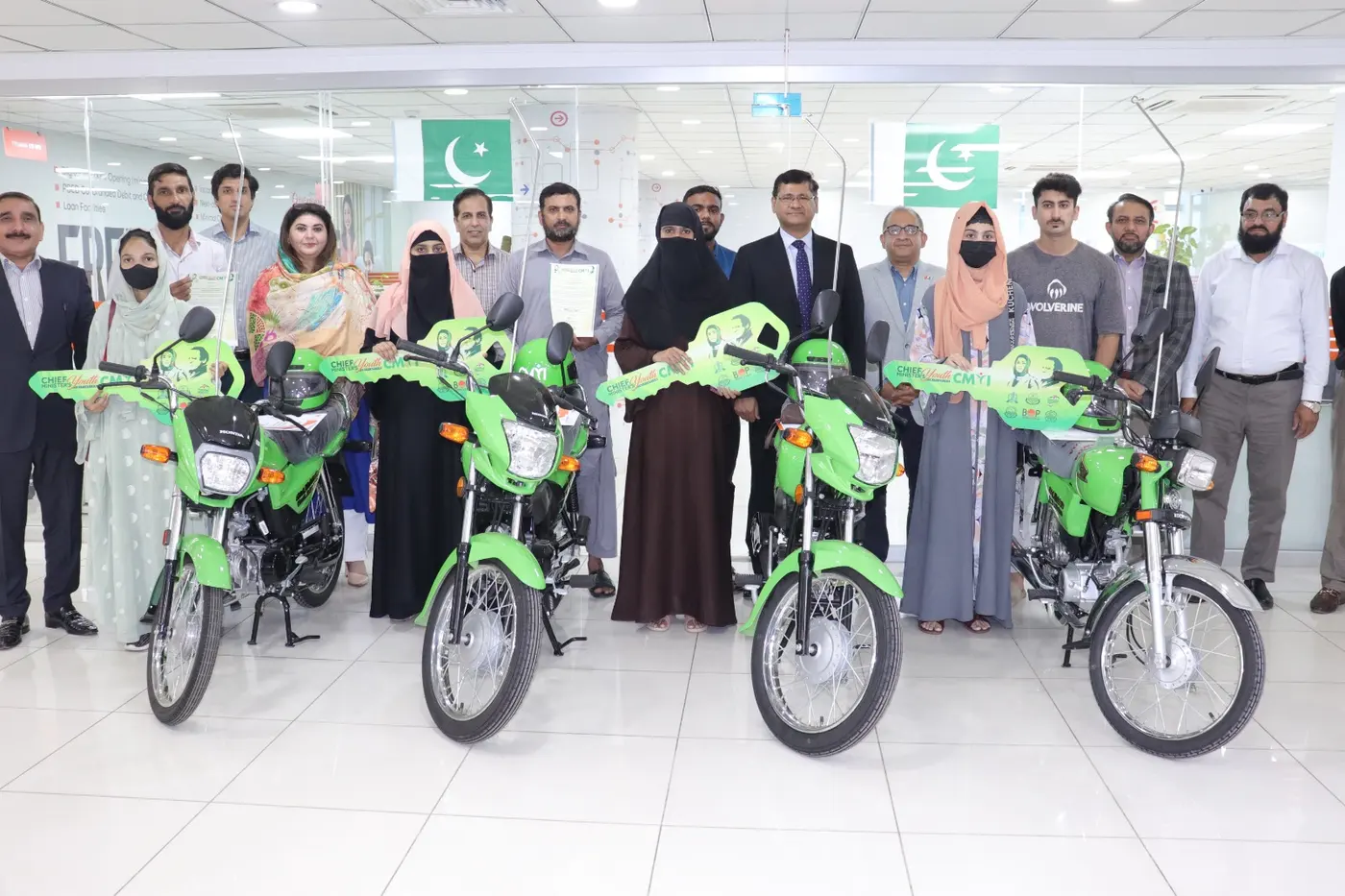 New green scheme motorcycles lined up for delivery